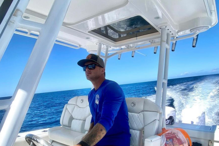 a person standing in front of a boat