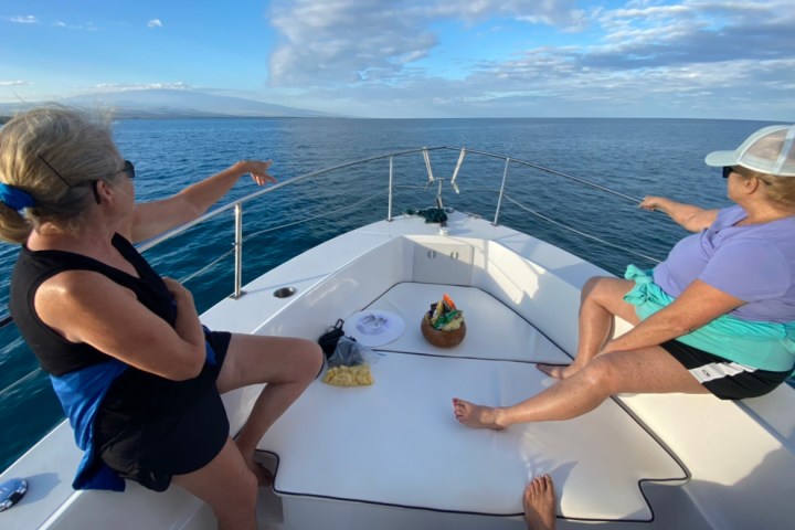 a person sitting on a boat in the water