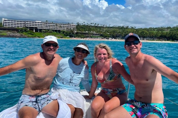 a person standing next to a body of water