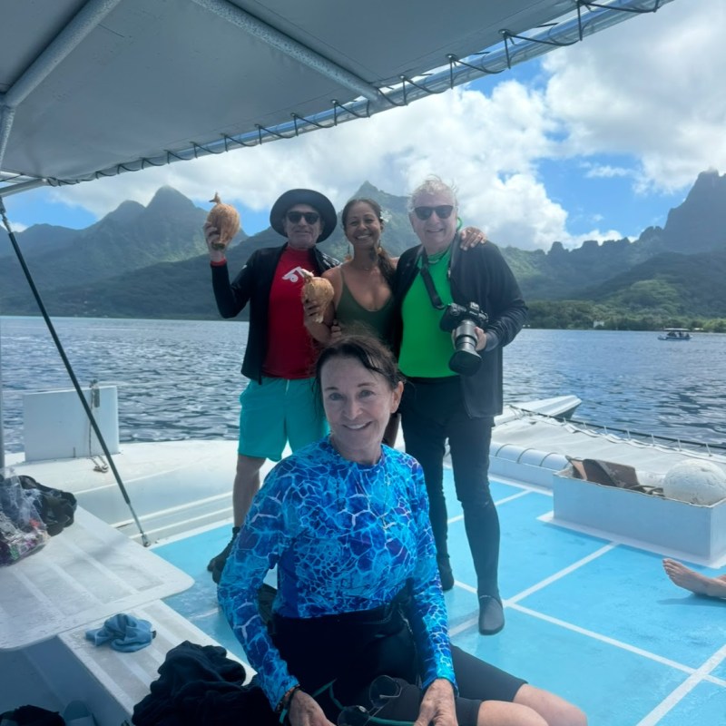 a group of people in a boat on a body of water